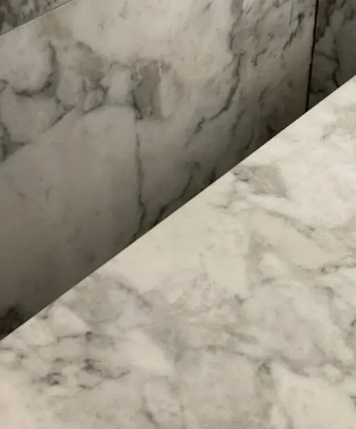 After — core-drilled tap hole in a marble bench top