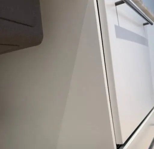 After — deep gouge in a flat white cabinet door