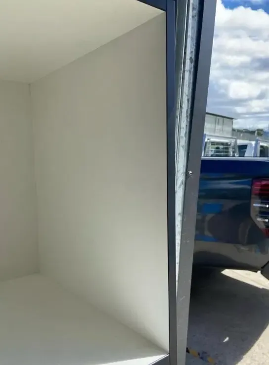 After: chips knocked through the paint on a white wall panel