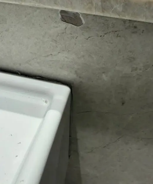 Before — chip in the front edge of a stone bench top