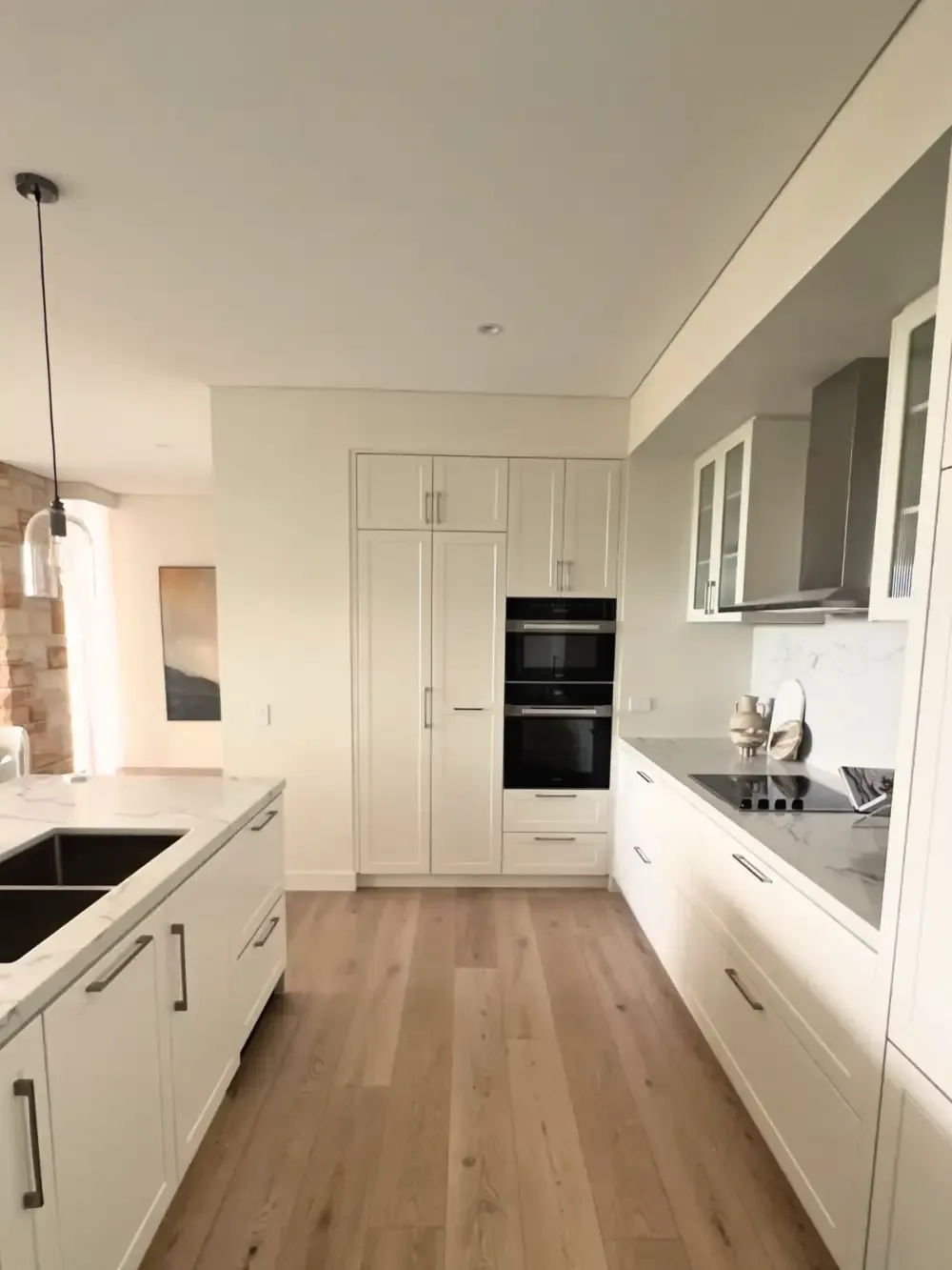 White laminate kitchen benchtop and cupboards