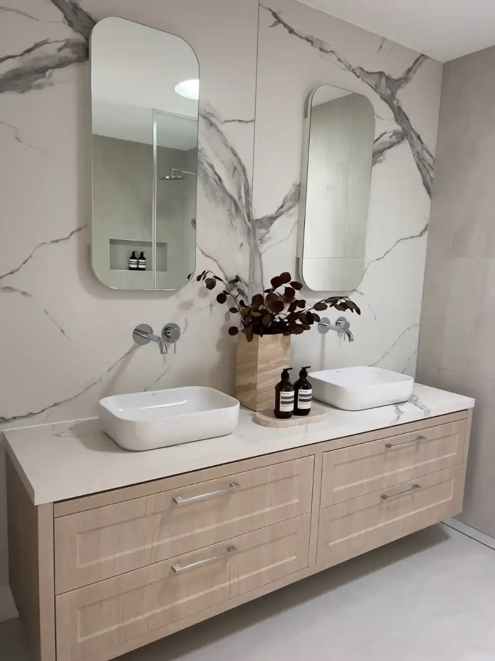 Tiled bathroom wall and double vanity